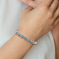 Sterling Silver Rhodium-Plated Light Swiss Blue Topaz Hinged Bangle