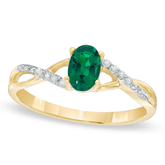 Oval Lab-Created Emerald and Diamond Accent Twist Engagement Ring in Solid 10K Yellow Gold