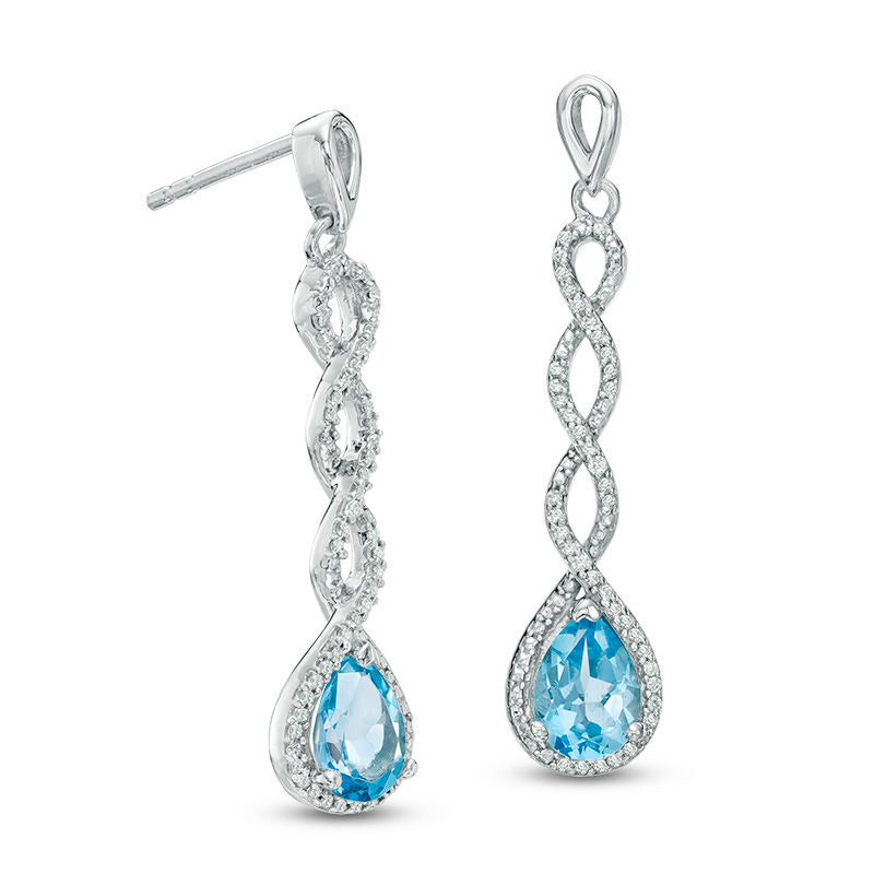 Pear-Shaped Blue Topaz and 0.2 CT. T.W. Diamond Frame Cascading Drop Earrings in 10K White Gold