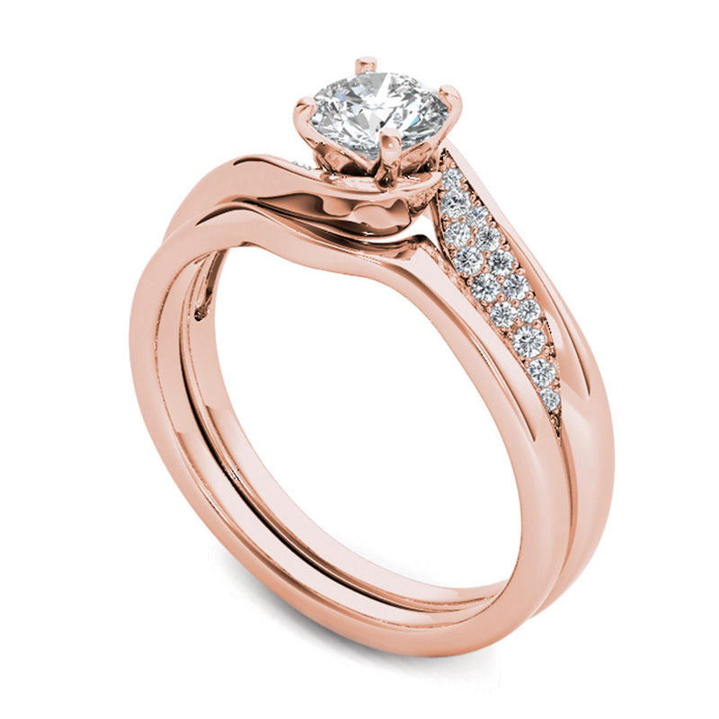 0.63 CT. T.W. Natural Diamond Twist Bypass Bridal Engagement Ring Set in Solid 14K Rose Gold