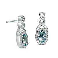 Oval Aquamarine and 0.1 CT. T.W. Diamond Frame Twist Drop Earrings in Sterling Silver