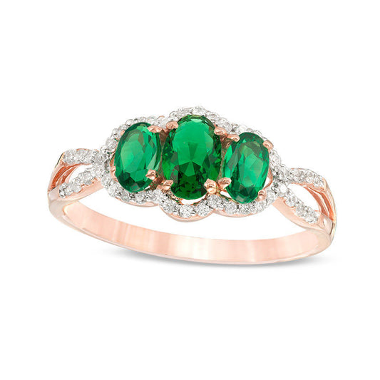 Oval Lab-Created Emerald and 0.17 CT. T.W. Diamond Frame Three Stone Engagement Ring in Solid 10K Rose Gold