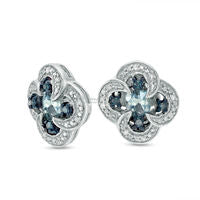 Oval Blue Topaz and 0.1 CT. T.W. Enhanced Blue and White Diamond Swirl Frame Clover Stud Earrings in Sterling Silver