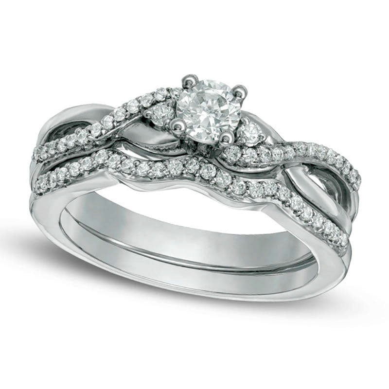 0.33 CT. T.W. Natural Diamond Three Stone Twist Bridal Engagement Ring Set in Sterling Silver