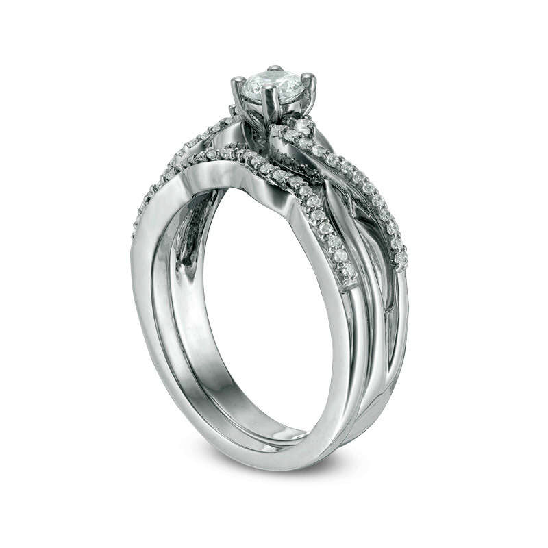 0.33 CT. T.W. Natural Diamond Three Stone Twist Bridal Engagement Ring Set in Sterling Silver