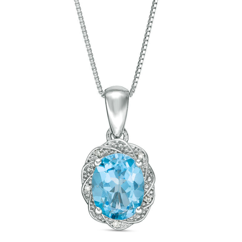 Oval Blue Topaz and Natural Diamond Accent Pinwheel Frame Pendant in Sterling Silver