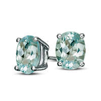 Oval Blue Topaz Solitaire Stud Earrings in Sterling Silver