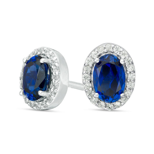 Oval Lab-Created Blue Sapphire and 0.13 CT. T.W. Diamond Frame Stud Earrings in 10K White Gold