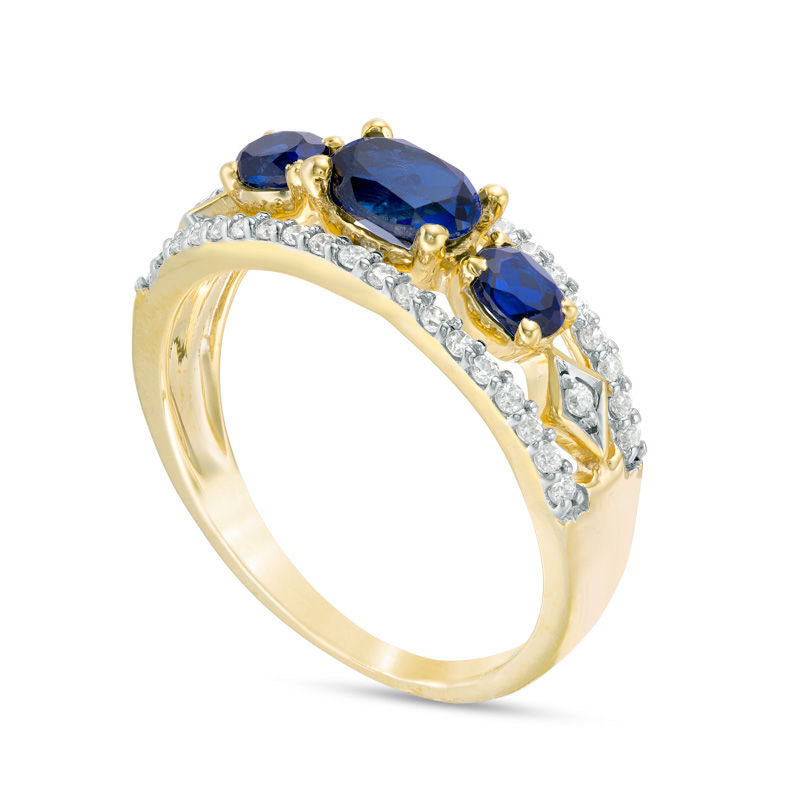 Sideways Oval Lab-Created Blue Sapphire and 0.25 CT. T.W. Diamond Three Stone Ring in Solid 10K Yellow Gold