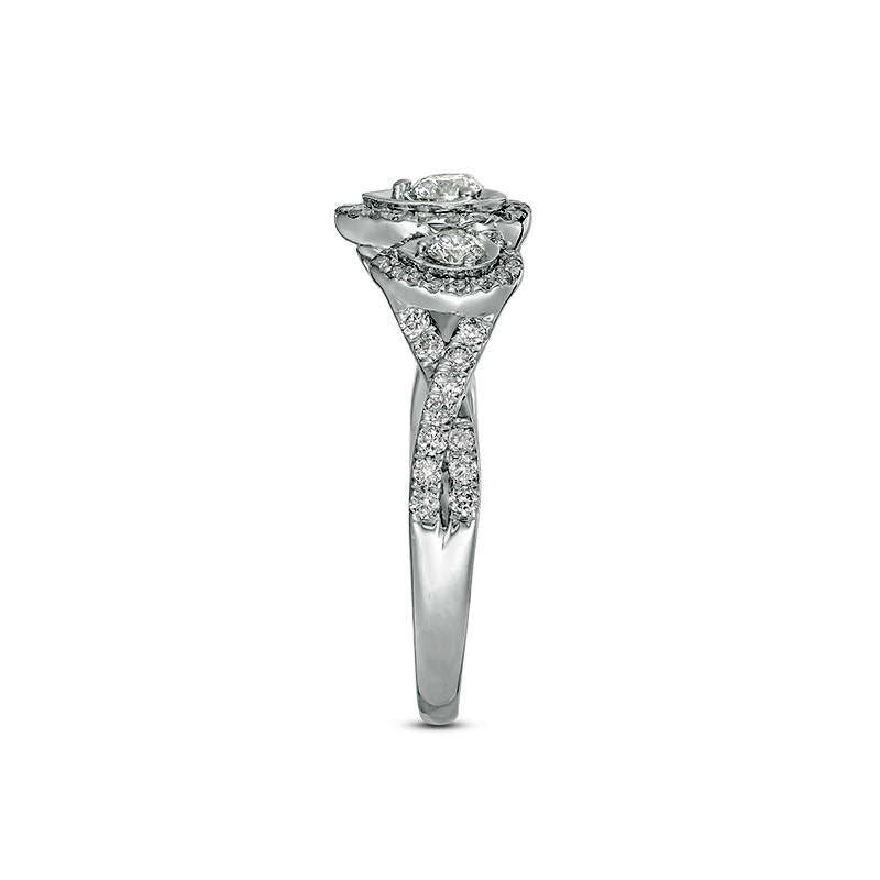 0.75 CT. T.W. Natural Diamond Three Stone Pear-Shaped Frame Twist Engagement Ring in Solid 10K White Gold