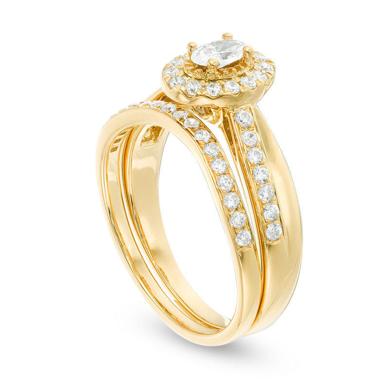 0.75 CT. T.W. Oval Natural Diamond Frame Crossover Bridal Engagement Ring Set in Solid 14K Gold