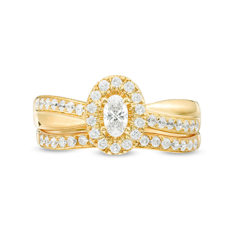 0.75 CT. T.W. Oval Natural Diamond Frame Crossover Bridal Engagement Ring Set in Solid 14K Gold