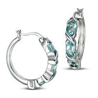 Oval Blue Topaz Three Stone Hoop Earrings in Sterling Silver