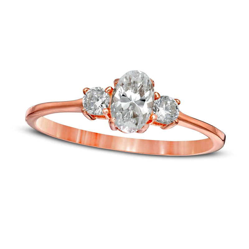 0.63 CT. T.W. Oval and Round Natural Diamond Three Stone Engagement Ring in Solid 14K Rose Gold