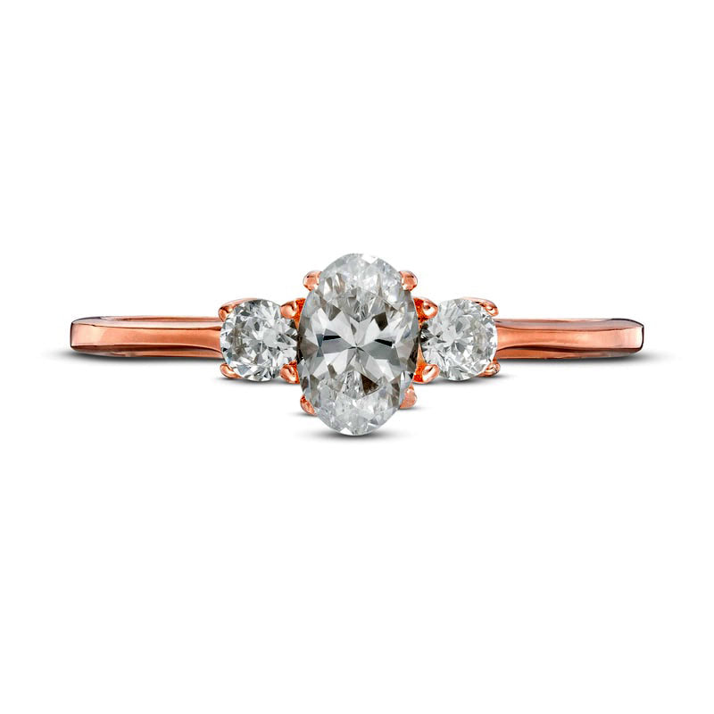 0.63 CT. T.W. Oval and Round Natural Diamond Three Stone Engagement Ring in Solid 14K Rose Gold