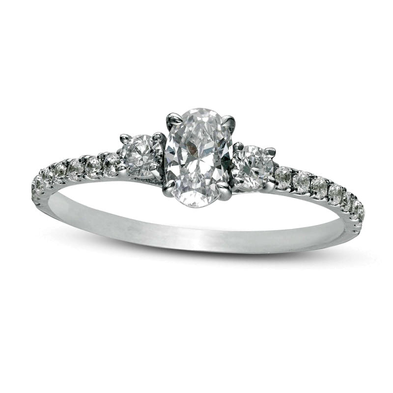 0.88 CT. T.W. Oval and Round Natural Diamond Three Stone Engagement Ring in Solid 14K White Gold