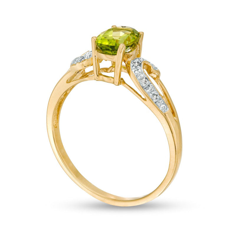 Oval Peridot and 0.05 CT. T.W. Natural Diamond Split Shank Scroll Ring in Solid 10K Yellow Gold