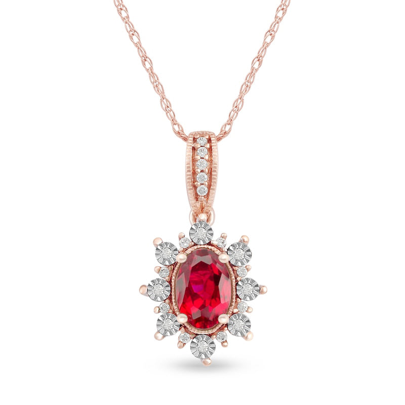 Oval Ruby and 0.07 CT. T.W. Natural Diamond Sunburst Frame Antique Vintage-Style Drop Pendant in 10K Rose Gold