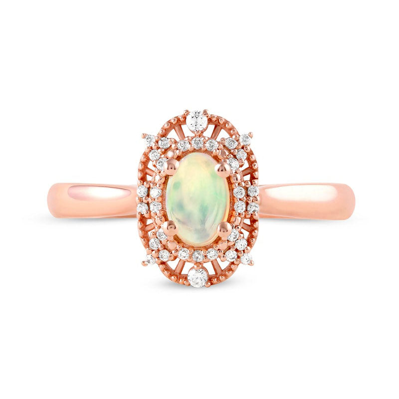 Oval Opal and 0.10 CT. T.W. Natural Diamond Bead Frame Sunburst Ring in Solid 10K Rose Gold