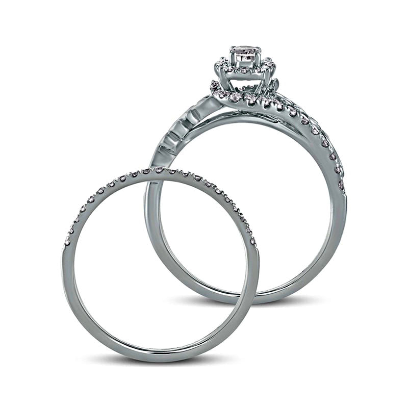 0.63 CT. T.W. Oval Natural Diamond Frame Filigree Bypass Bridal Engagement Ring Set in Solid 10K White Gold