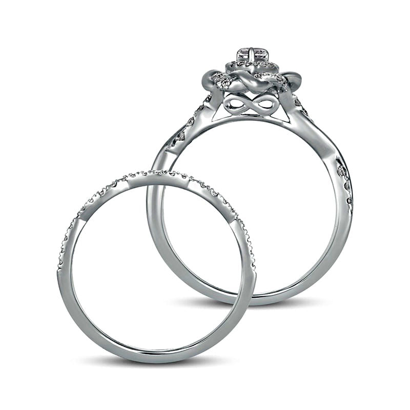 0.63 CT. T.W. Pear-Shaped Natural Diamond Frame Twist Shank Bridal Engagement Ring Set in Solid 10K White Gold