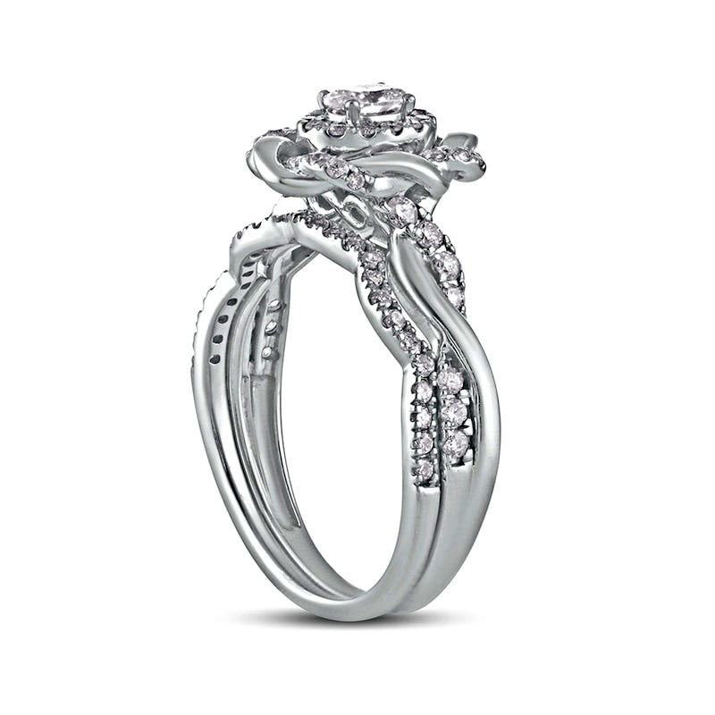 0.63 CT. T.W. Oval Natural Diamond Frame Twist Shank Bridal Engagement Ring Set in Solid 10K White Gold