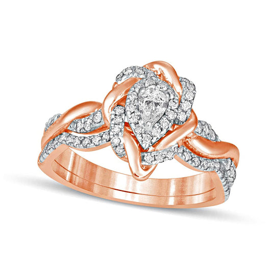 0.63 CT. T.W. Pear-Shaped Natural Diamond Frame Twist Shank Bridal Engagement Ring Set in Solid 10K Rose Gold