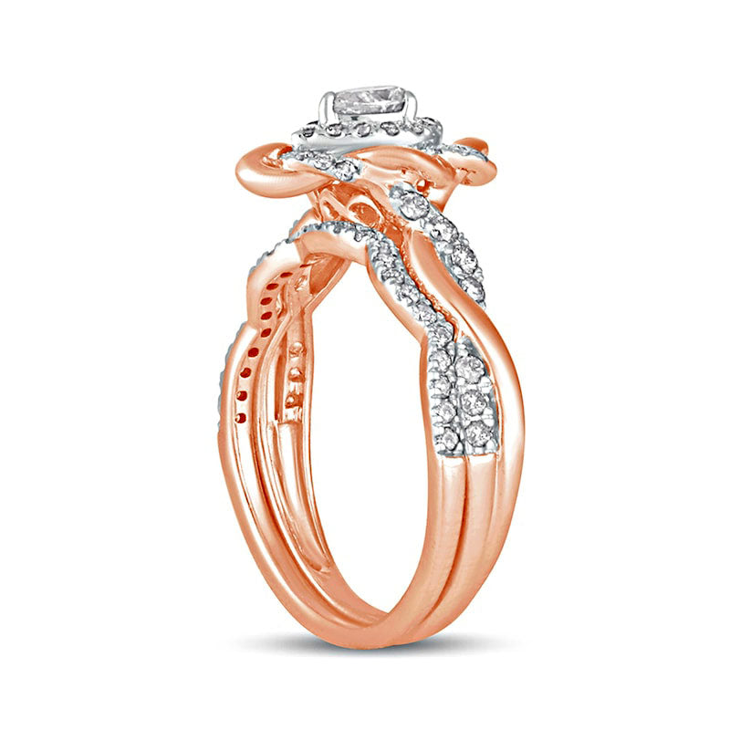 0.63 CT. T.W. Pear-Shaped Natural Diamond Frame Twist Shank Bridal Engagement Ring Set in Solid 10K Rose Gold