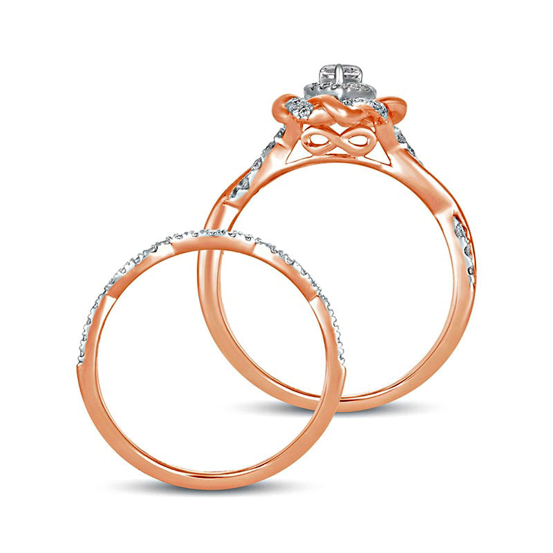 0.63 CT. T.W. Pear-Shaped Natural Diamond Frame Twist Shank Bridal Engagement Ring Set in Solid 10K Rose Gold