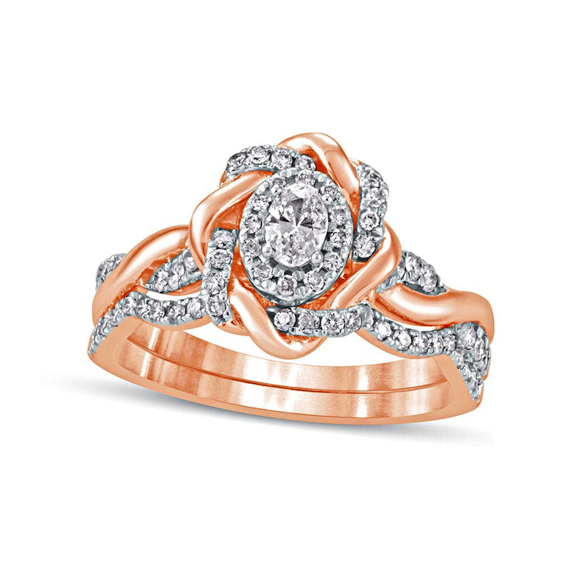 0.63 CT. T.W. Oval Natural Diamond Frame Twist Shank Bridal Engagement Ring Set in Solid 10K Rose Gold