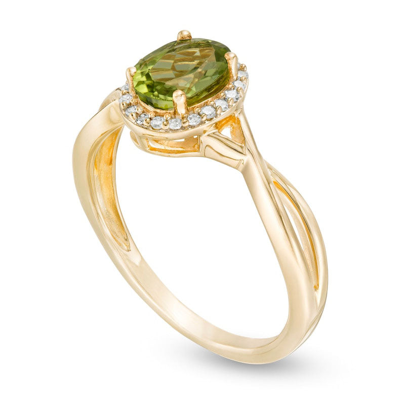 Oval Peridot and 0.07 CT. T.W. Natural Diamond Frame Twist Shank Ring in Solid 10K Yellow Gold