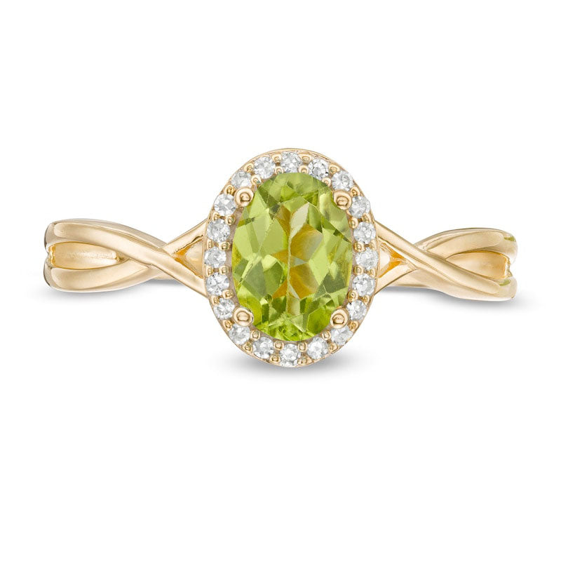 Oval Peridot and 0.07 CT. T.W. Natural Diamond Frame Twist Shank Ring in Solid 10K Yellow Gold