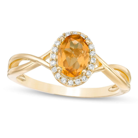 Oval Citrine and 0.07 CT. T.W. Natural Diamond Frame Twist Shank Ring in Solid 10K Yellow Gold