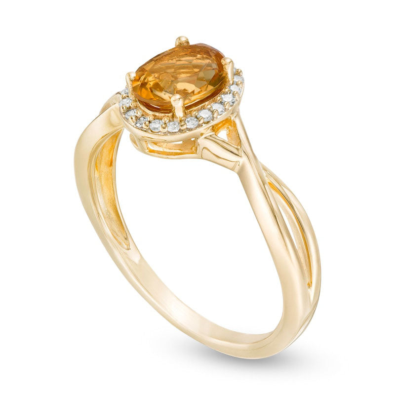 Oval Citrine and 0.07 CT. T.W. Natural Diamond Frame Twist Shank Ring in Solid 10K Yellow Gold