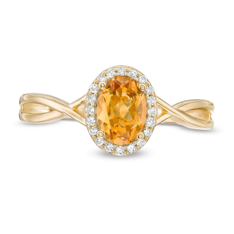 Oval Citrine and 0.07 CT. T.W. Natural Diamond Frame Twist Shank Ring in Solid 10K Yellow Gold