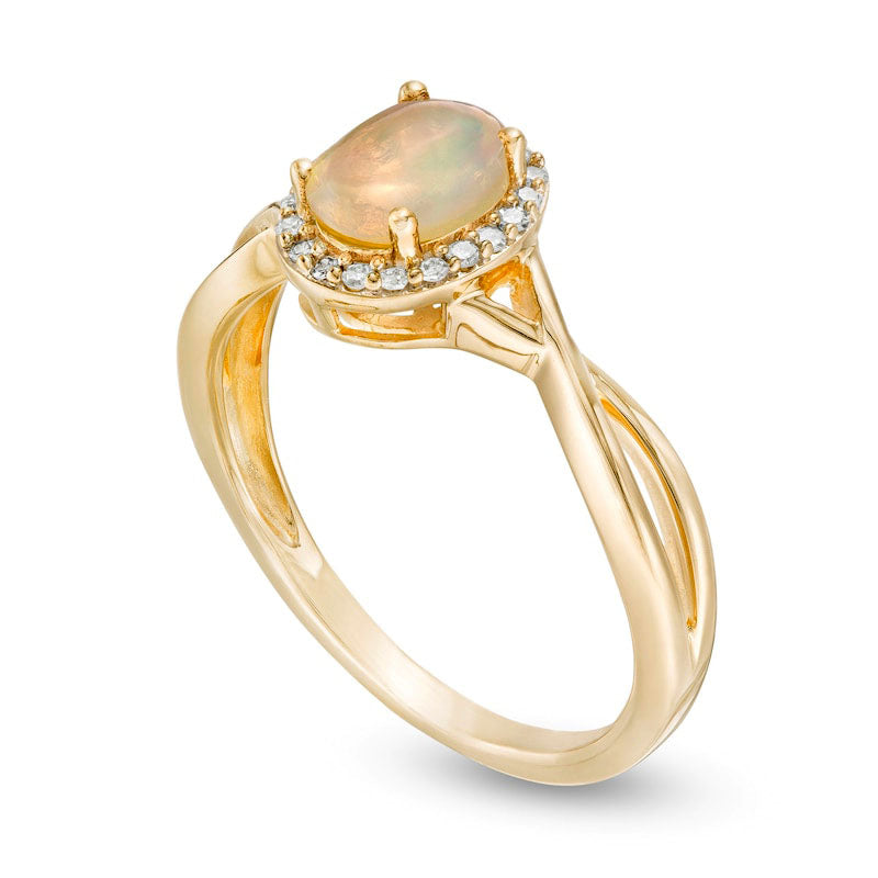 Oval Opal and 0.07 CT. T.W. Natural Diamond Frame Twist Shank Ring in Solid 10K Yellow Gold