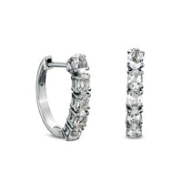 Oval White Topaz Huggie Hoop Earrings in Sterling Silver