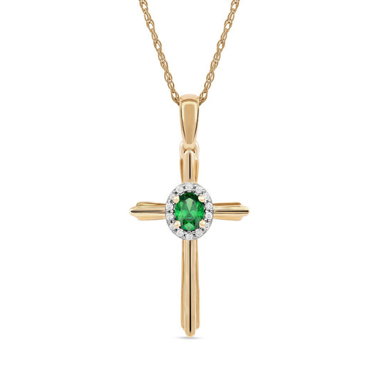 Oval Emerald and 0.05 CT. T.W. Natural Diamond Frame Layered Cross Pendant in 10K Yellow Gold