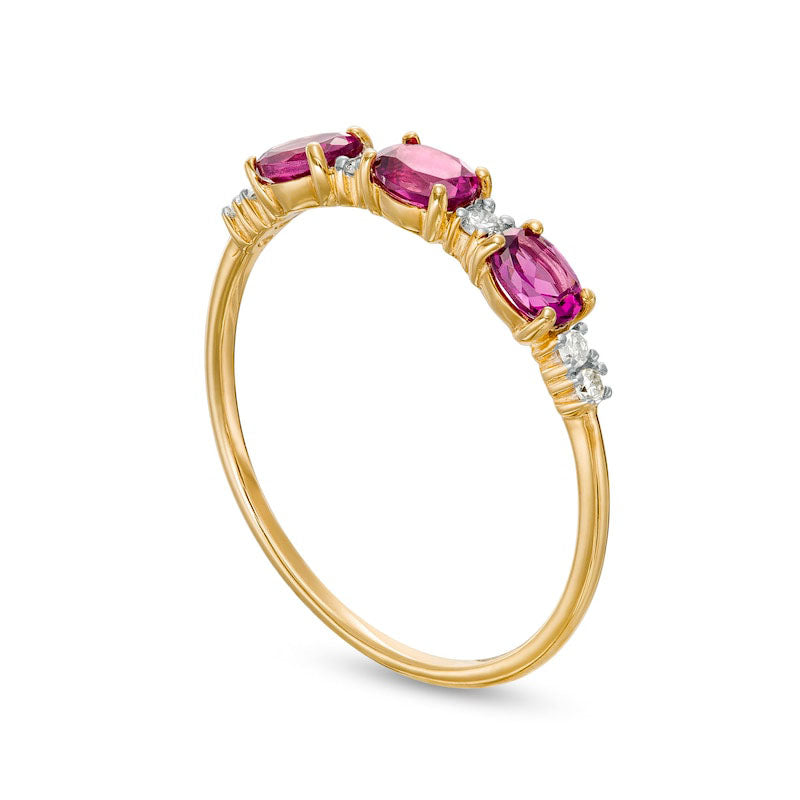 Sideways Oval Rhodolite and 0.07 CT. T.W. Natural Diamond Three Stone Ring in Solid 10K Yellow Gold