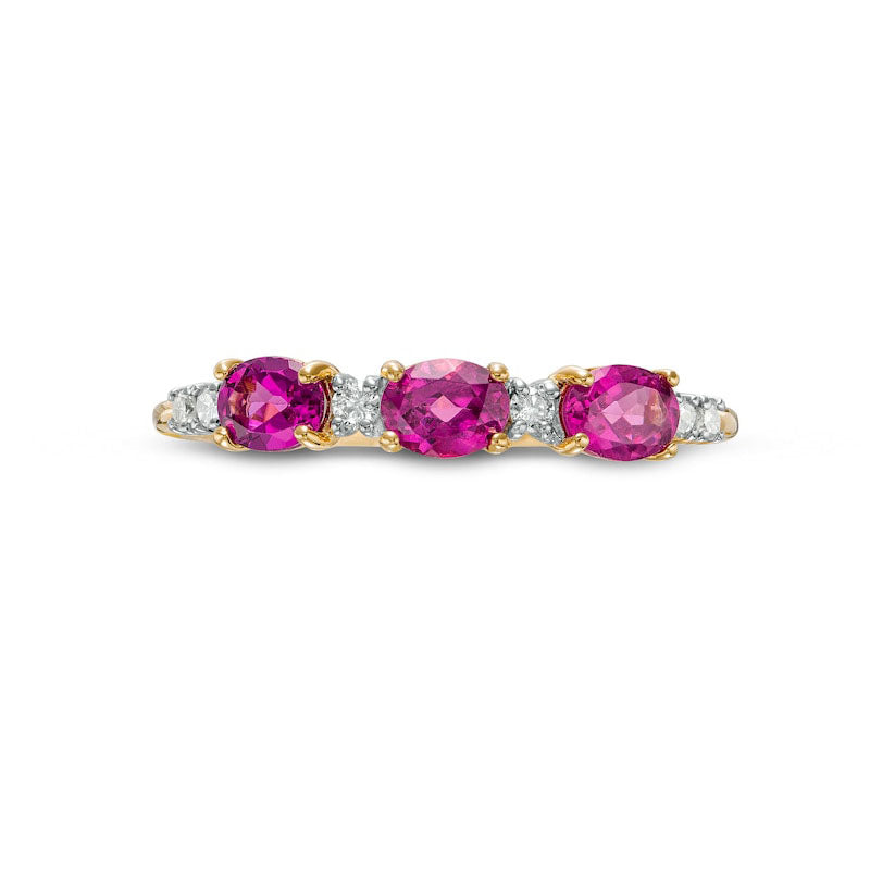 Sideways Oval Rhodolite and 0.07 CT. T.W. Natural Diamond Three Stone Ring in Solid 10K Yellow Gold