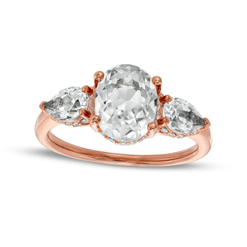 Oval White Lab-Created Sapphire and 0.17 CT. T.W. Diamond Frame Three Stone Engagement Ring in Solid 10K Rose Gold