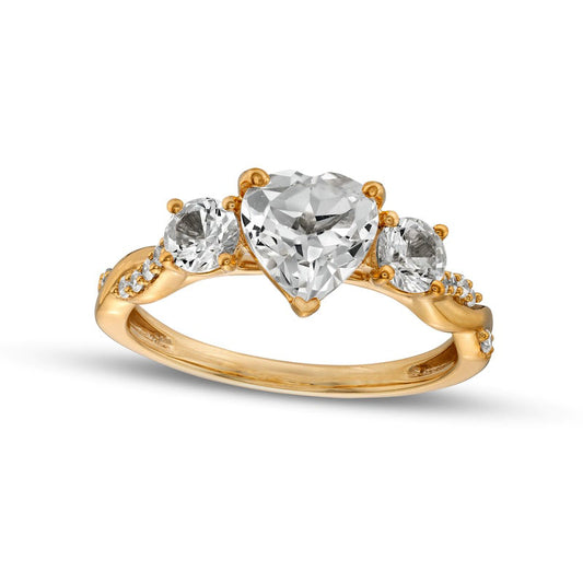 Heart-Shaped White Lab-Created Sapphire and 0.10 CT. T.W. Diamond Three Stone Twist Shank Engagement Ring in Solid 10K Yellow Gold