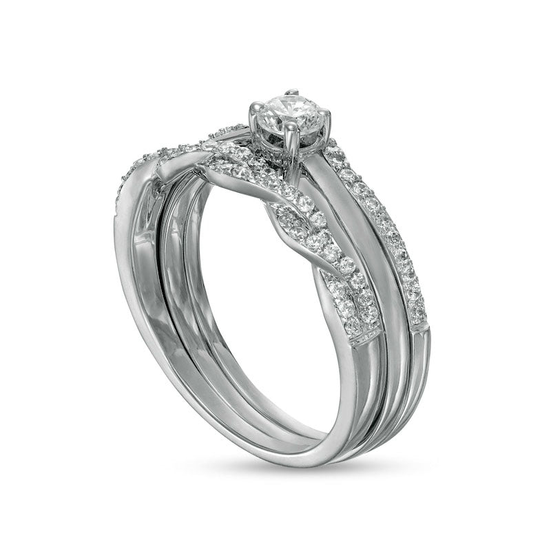 0.50 CT. T.W. Natural Diamond Twist Three Piece Bridal Engagement Ring Set in Solid 10K White Gold (J/I3)