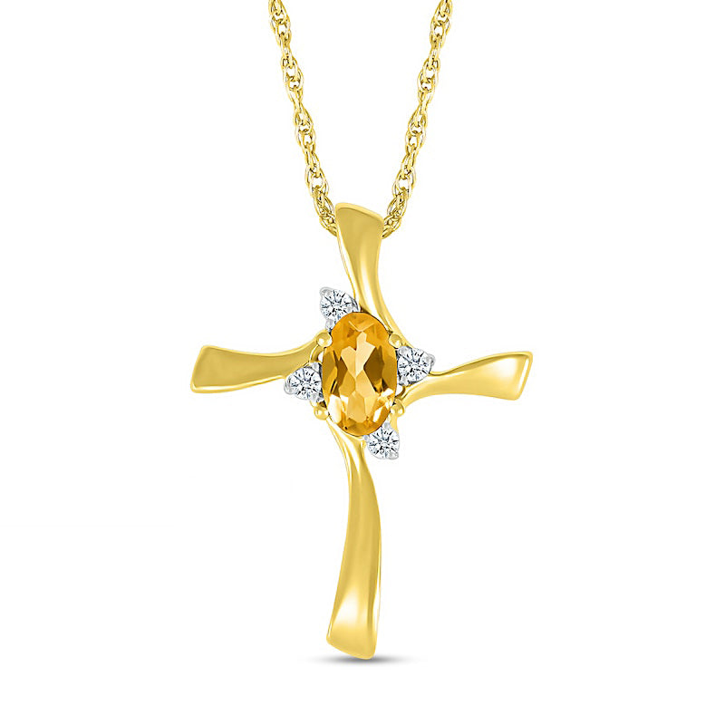 Oval Citrine and Natural Diamond Accent Swirl Ribbon Cross Pendant in 10K Yellow Gold