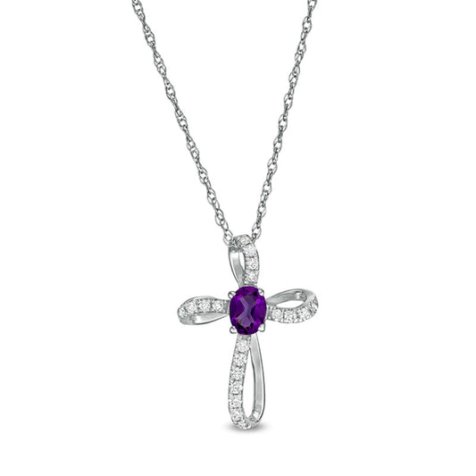 Oval Amethyst and 0.1 CT. T.W. Natural Diamond Pinwheel Cross Pendant in 10K White Gold