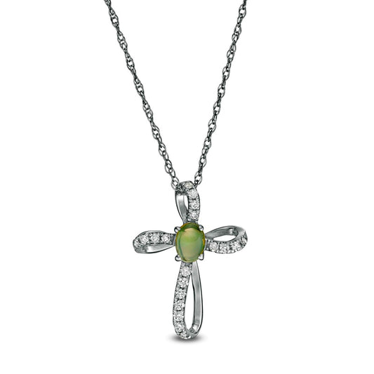 Oval Opal and 0.1 CT. T.W. Natural Diamond Pinwheel Cross Pendant in 10K White Gold