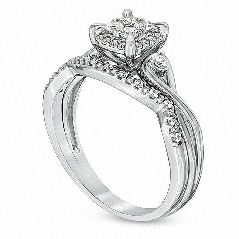 Previously Owned - 0.33 CT. T.W. Quad Natural Diamond Frame Twist Shank Bridal Engagement Ring Set in Solid 10K White Gold