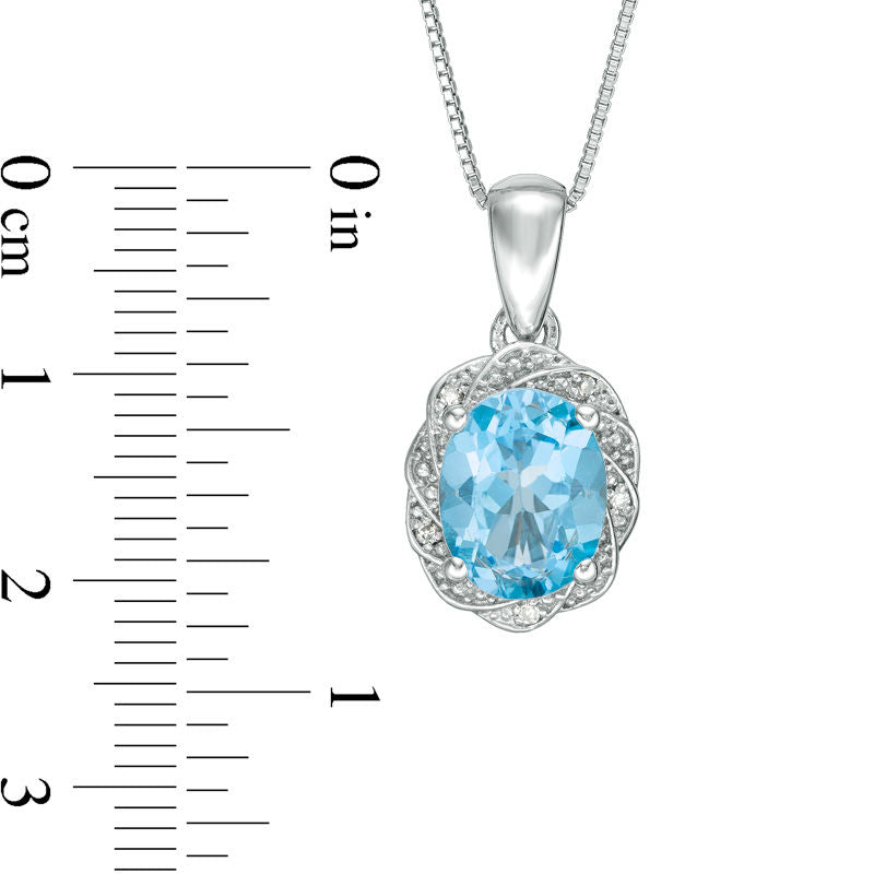 Oval Blue Topaz and Natural Diamond Accent Pinwheel Frame Pendant in Sterling Silver