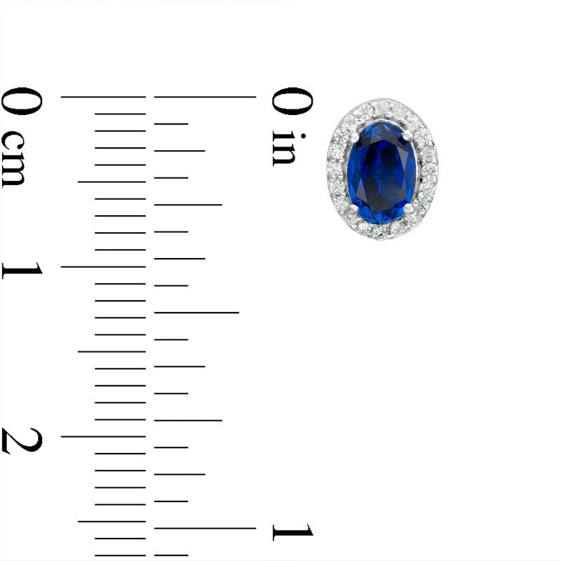 Oval Lab-Created Blue Sapphire and 0.13 CT. T.W. Diamond Frame Stud Earrings in 10K White Gold