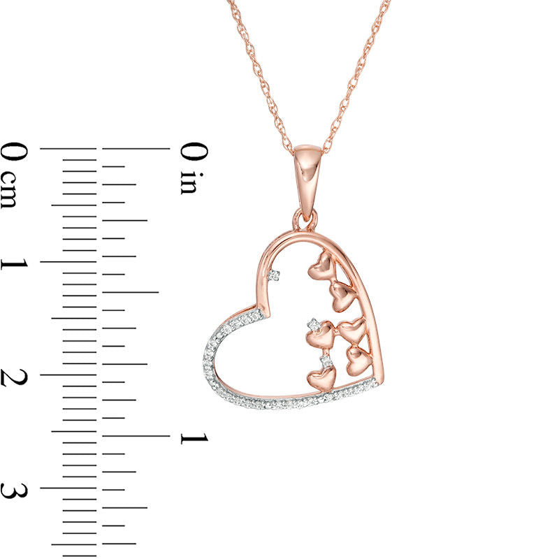 0.1 CT. T.W. Scattered Natural Diamond Tilted Heart Outline Pendant in 10K Rose Gold